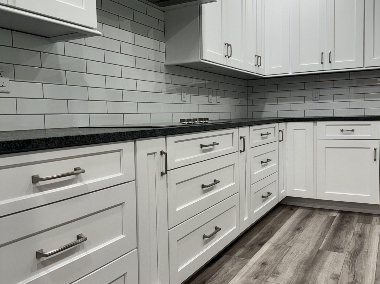 Hampshire cabinets, painted maple, base cabinets, subway tile, hood insert