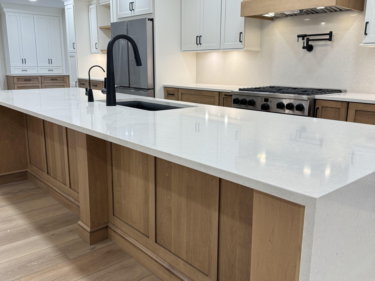 Hampshire cabinets, combo stained and painted maple, waterfall edge island