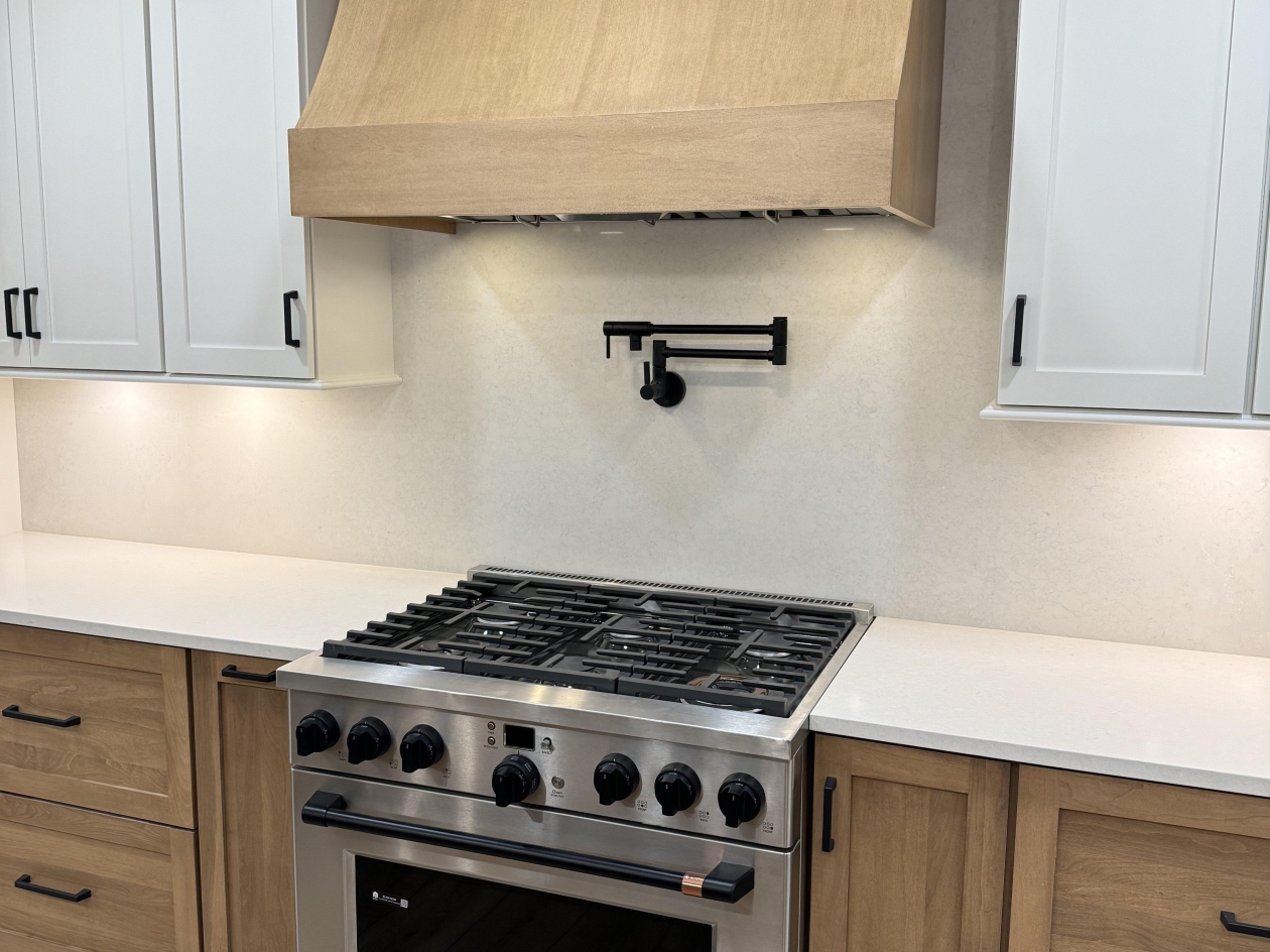 Hampshire cabinets, custom hood, cambria counter tops and backsplash