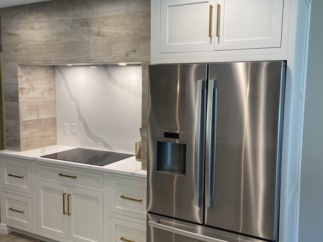 Mouser cabinetry, fridge panels, hood, painted maple