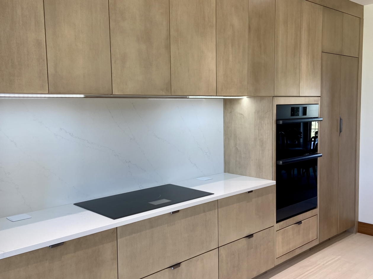 Mouse cabinetry, cooktop, doubl oven, Eurostyle cabinets, stained maple