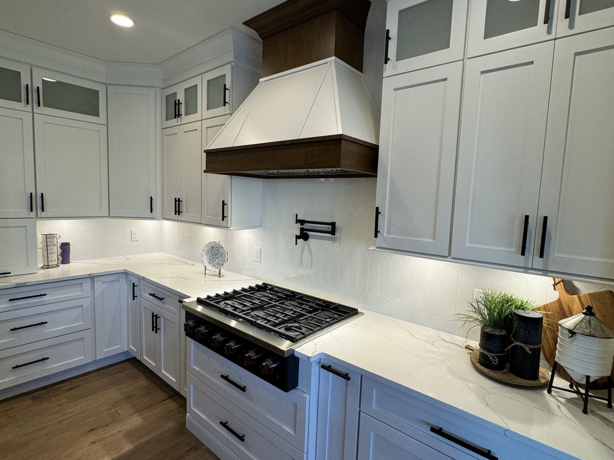 Hampshire cabinets, custom hood, quartz tops, painted maple cabinets